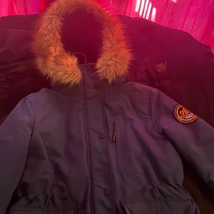 a navy blue superdry that’ll last you 2-3 years . it keeps you warm .